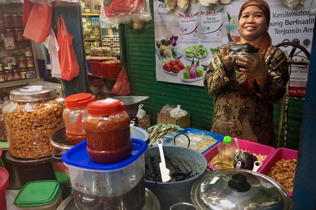 Picking up some snacks for the road at Pasar Genteng Baru. Photo by: Sally Arnold.
