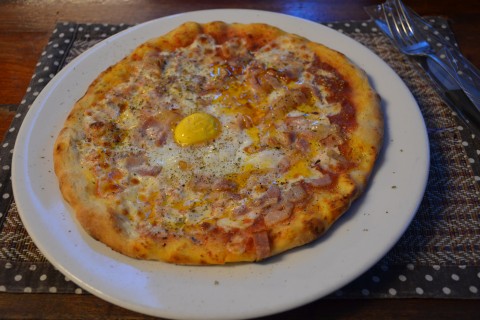 Satisfying a crave at Amido’s Pizza. Photo by: Mark Ord.