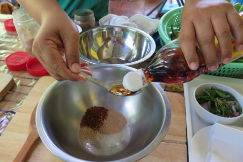 Measuring out the fish sauce and salty/spicy bits. Photo by: Lana Willocks.