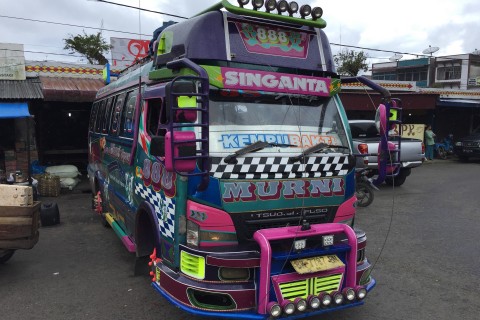 Berastagi is famous for these brightly coloured buses. Photo by: Stuart McDonald.